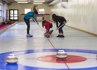 Friends trying curling together